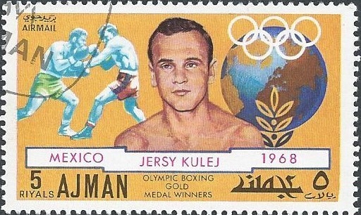 Podobizna na adżmańskim znaczku pocztowym, fot. Autorstwa Nieznany - http://www.catawiki.com/catalog/stamps/countries-regions-territories/ajman/4839047-famous-boxers?area=5b4ac578edbdd142a1710fc02ab7ba7e37fe1a4a, Domena publiczna, https://commons.wikimedia.org/w/index.php?curid=34570287